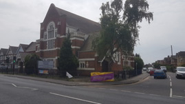 image shows a large church on the left corner of Loch Road as you face the turning from Ashley Road